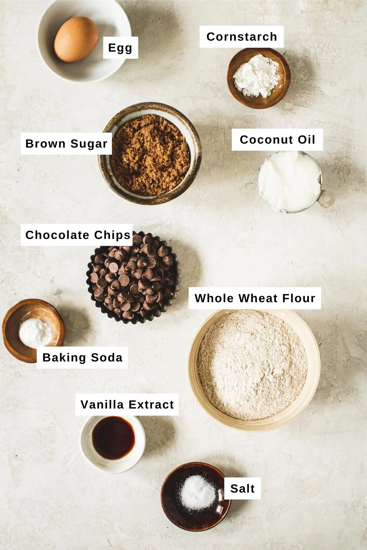 Whole wheat chocolate chip cookie ingredients in various bowls.