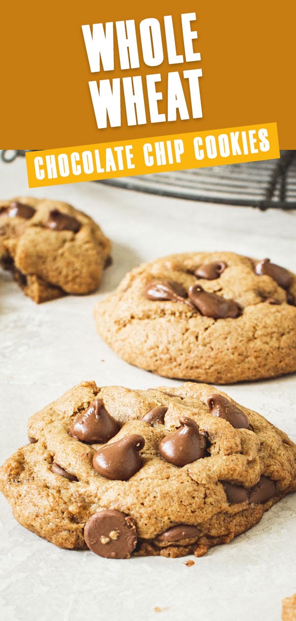 Whole wheat chocolate chip cookies with a wire rack in the background.