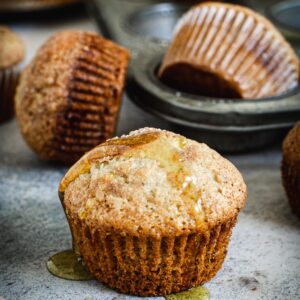 Single banana muffin with honey drizzle.
