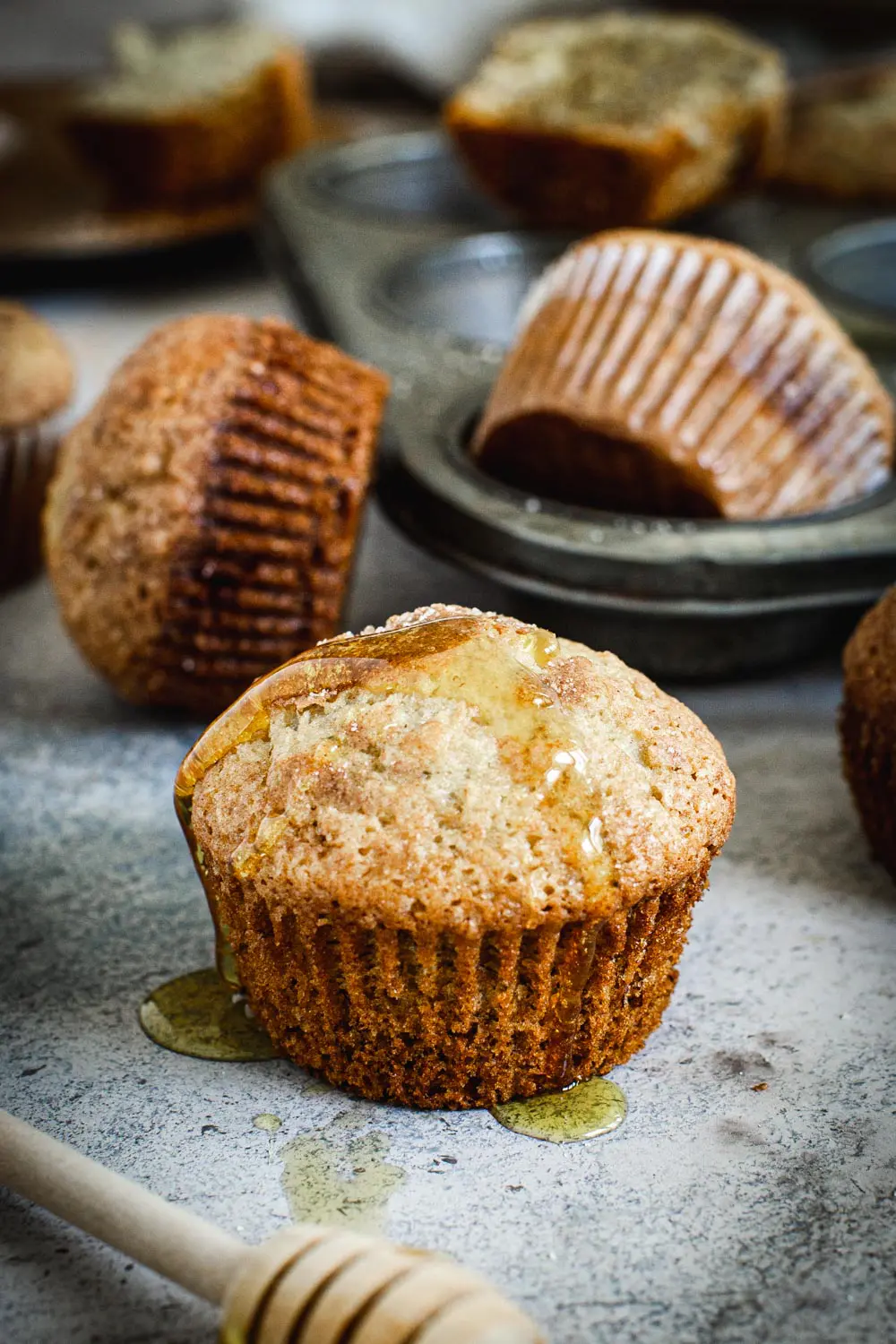 Single banana muffin with honey drizzle.