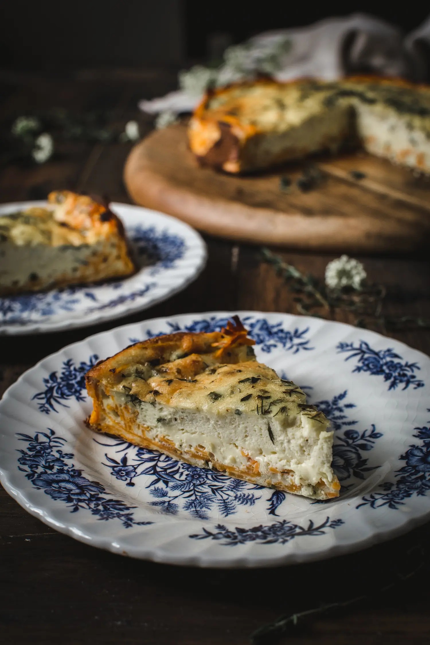 goat cheese quiche on blue and white china plate