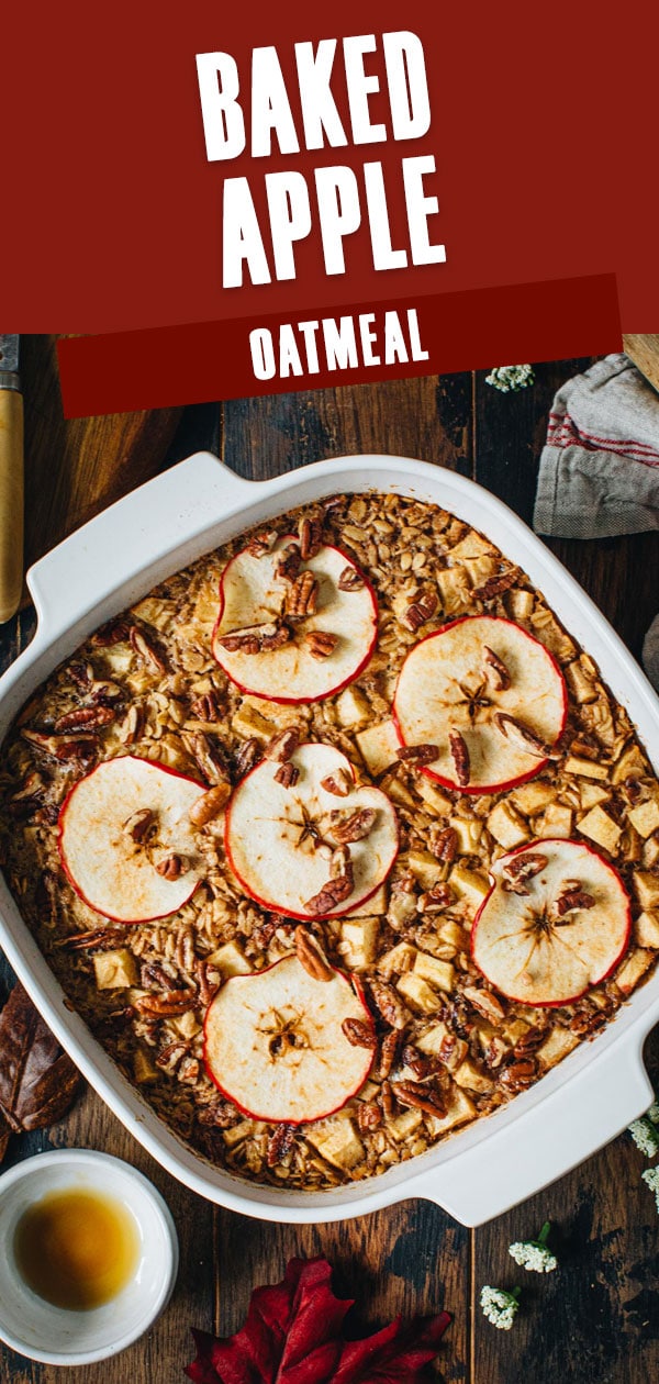 Baked apple oatmeal with pecans and sliced apples on top.