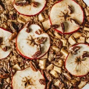 Baked apple oatmeal topped with apple slices.