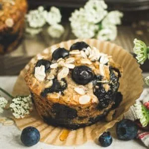 Blueberry oatmeal muffins with honey drizzled on top.