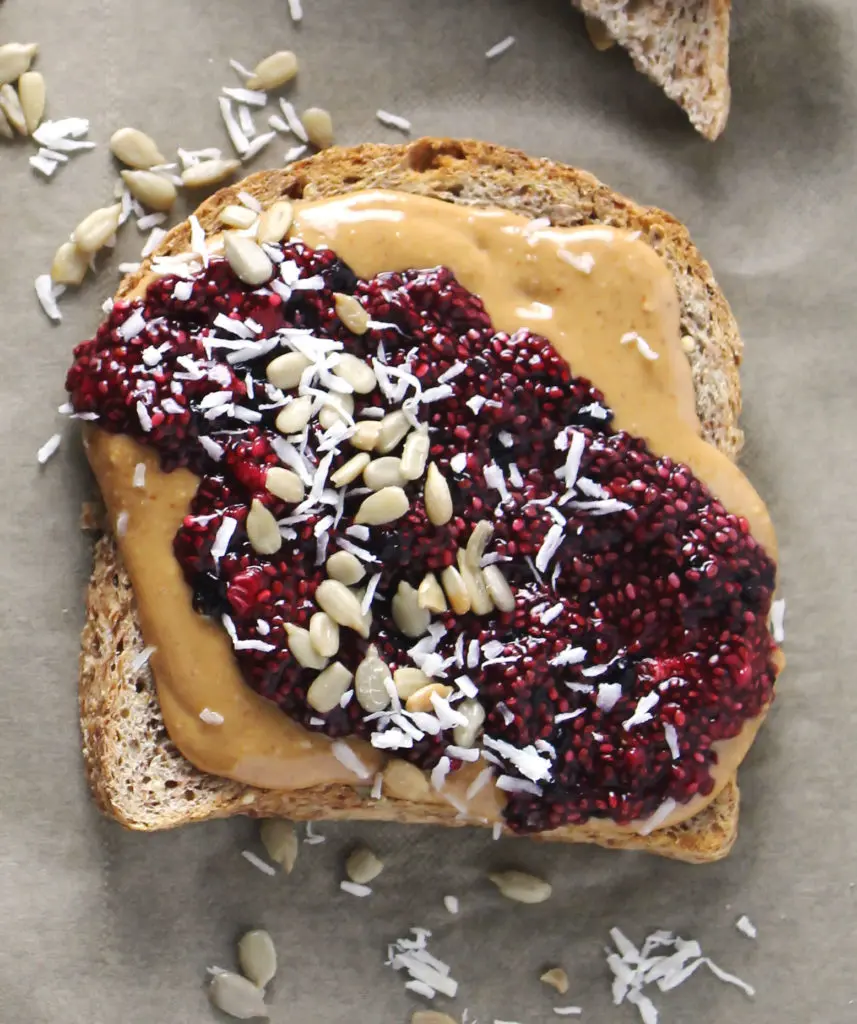 This simple recipe for Mixed Berry Chia Seed Jam Peanut Butter Breakfast Toasts will leave you satisfied and with plenty of jam for the week | via aimeemars.com | #ChiaSeedJam #BreafastToast #HomemadeJam 