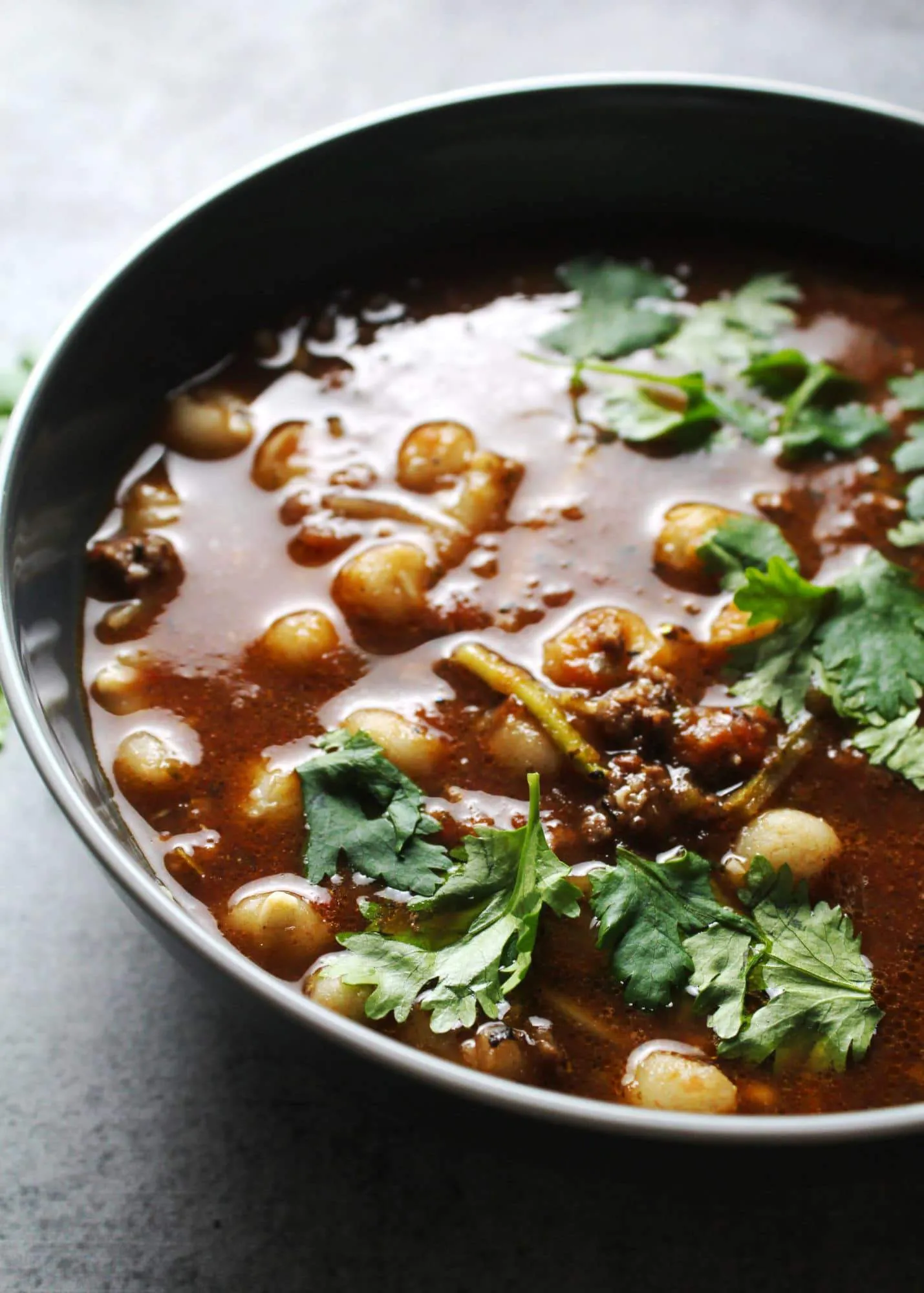 Beef stew in gray bowl