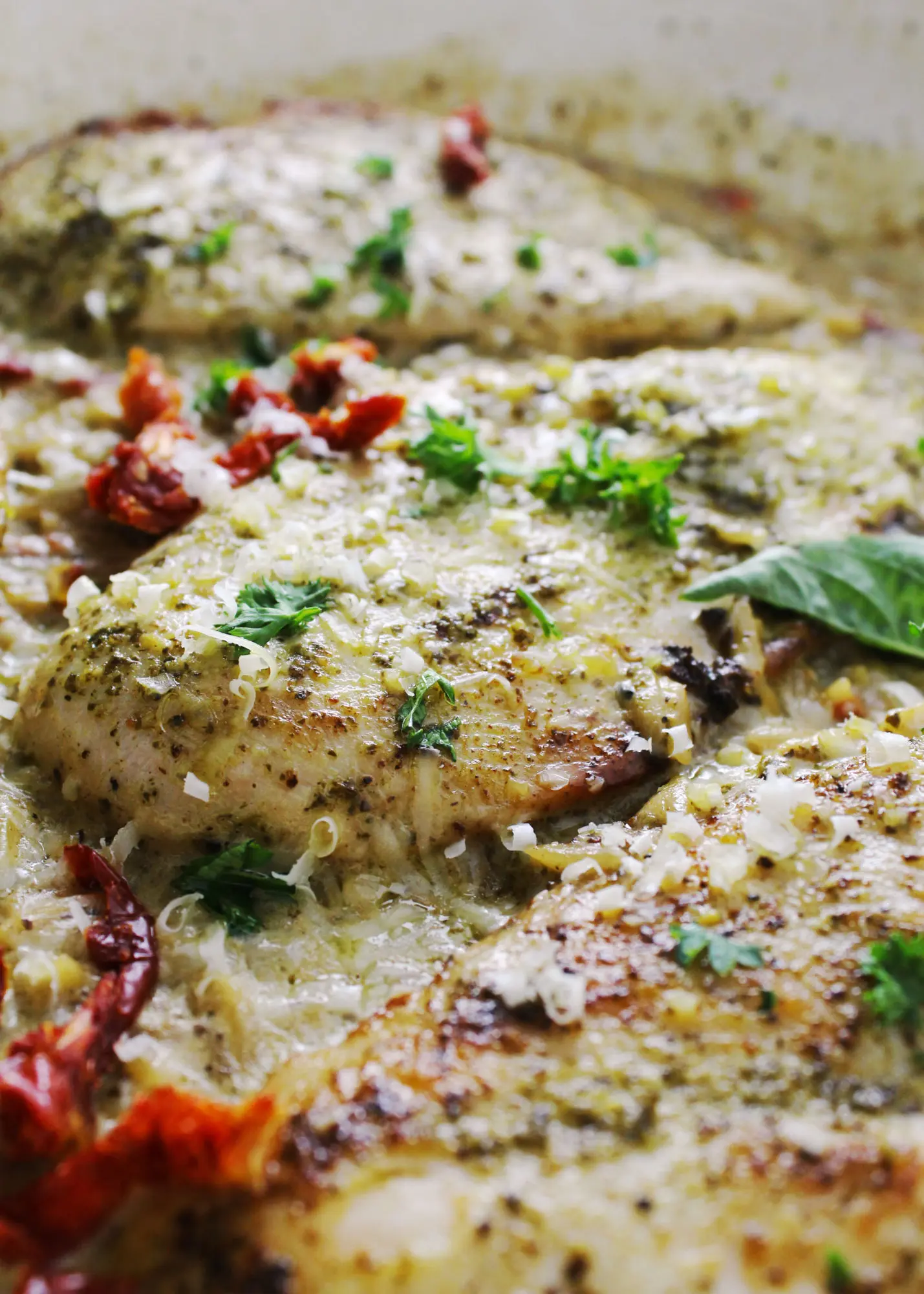 Pesto chicken in a creamy sauce with sun-dried tomatoes.