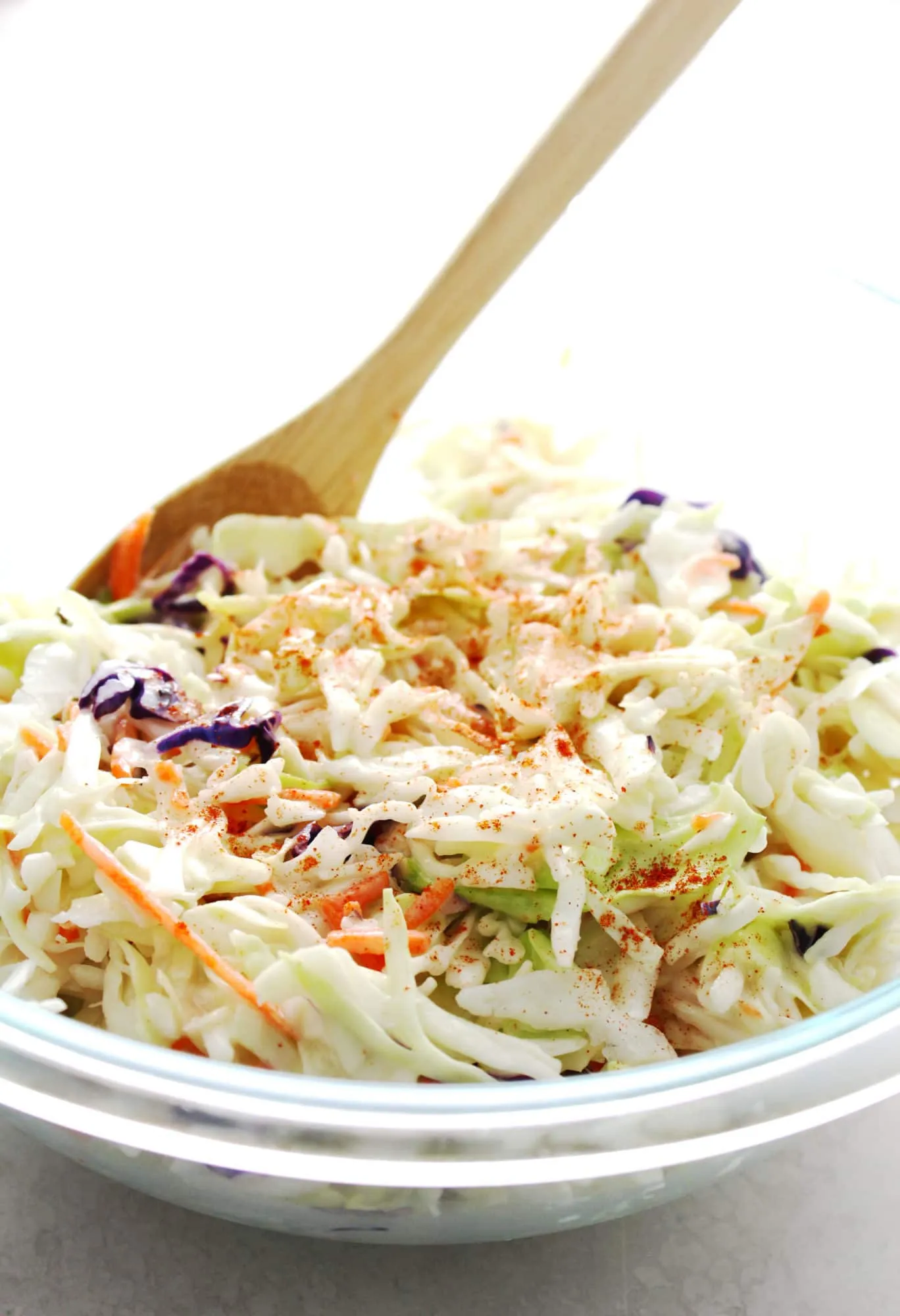 coleslaw in a clear glass bowl