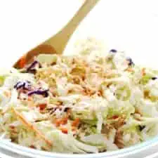 coleslaw in a clear glass bowl
