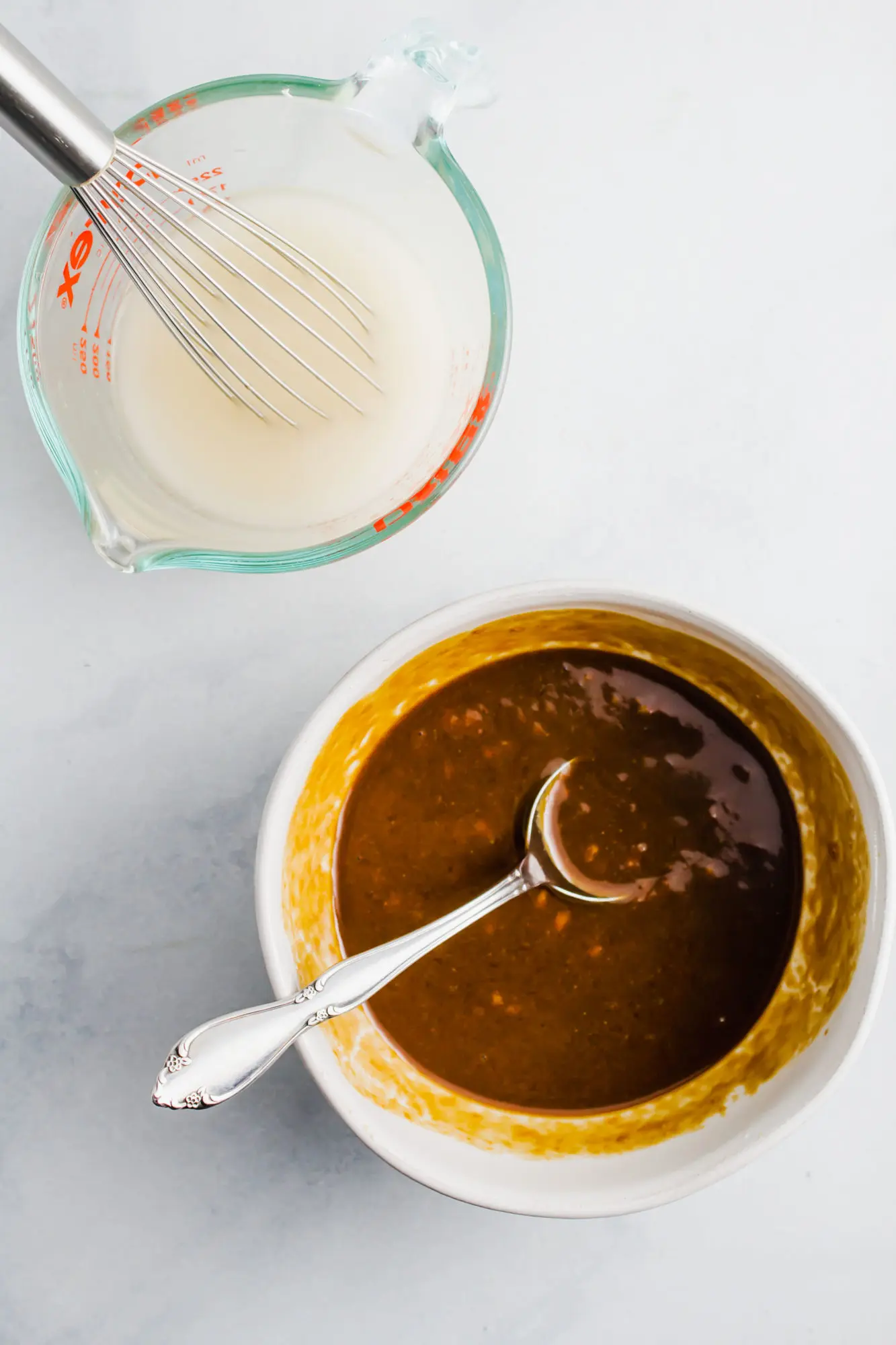 Ingredients for miso glaze in white bowl and measuring cup