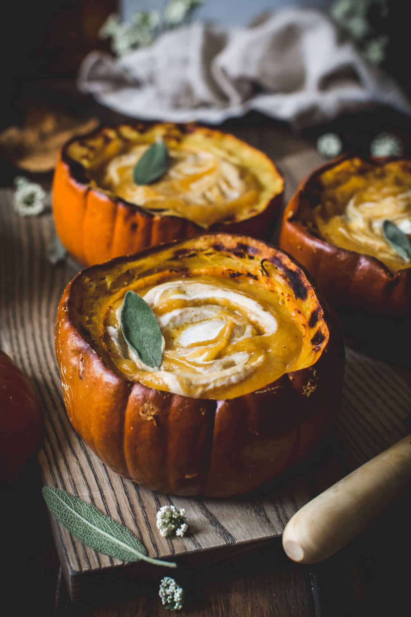 Butternut squash and pumpkin soup in a roasted pumpkin bowl.