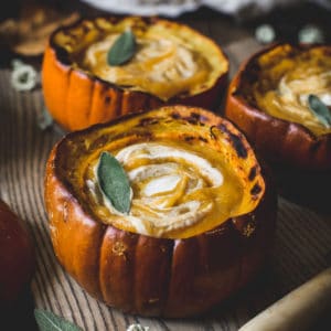 Butternut squash and pumpkin soup in a roasted pumpkin bowl.