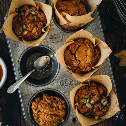 Vegan pumpkin muffins in a muffin tin.