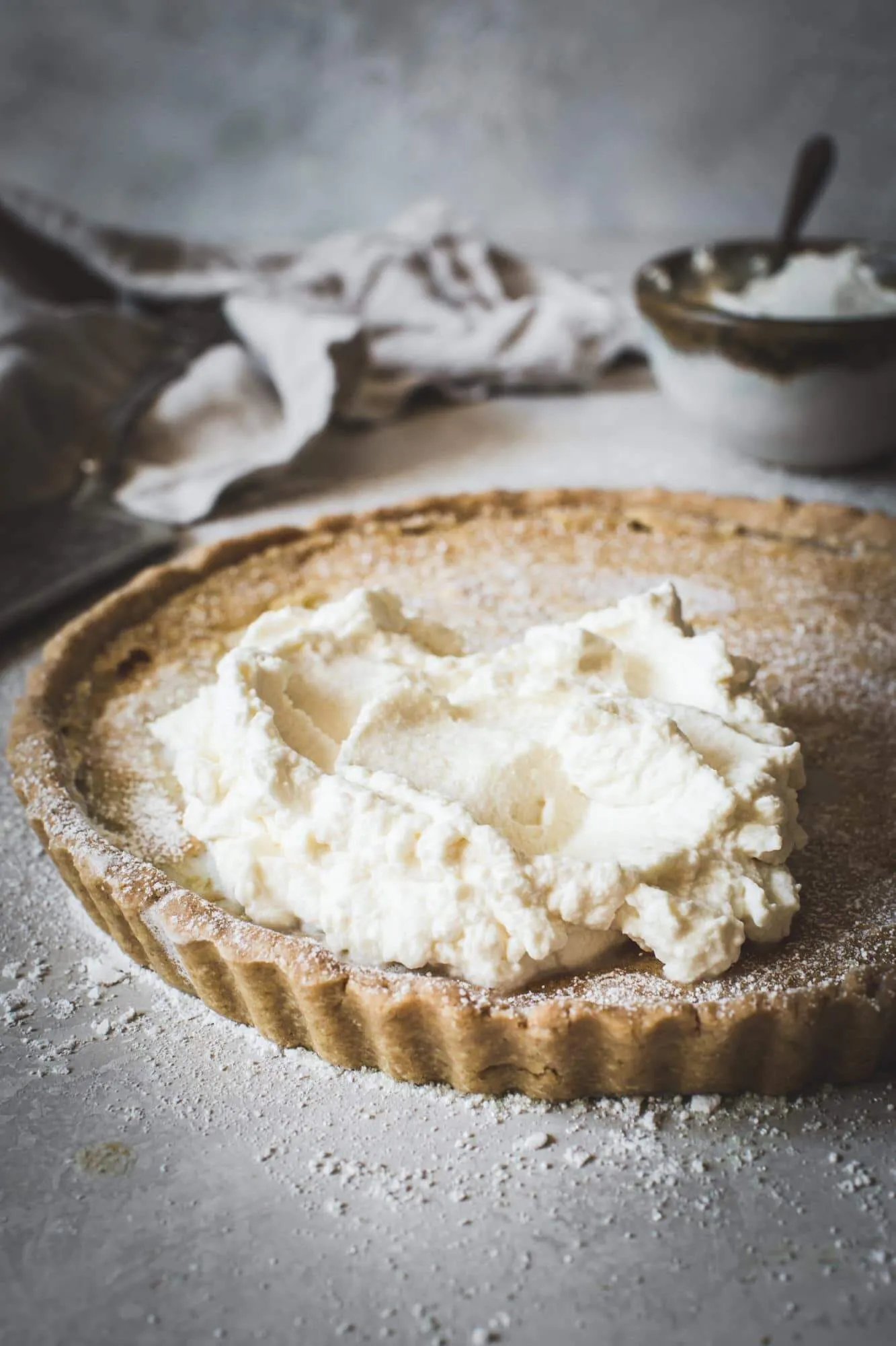 Old Fashioned Chess Pie with homemade whipped cream and powdered sugar