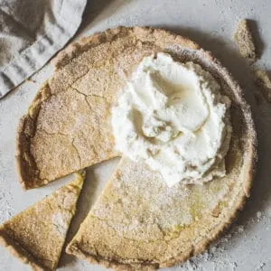 Chess pie topped with whipped cream.