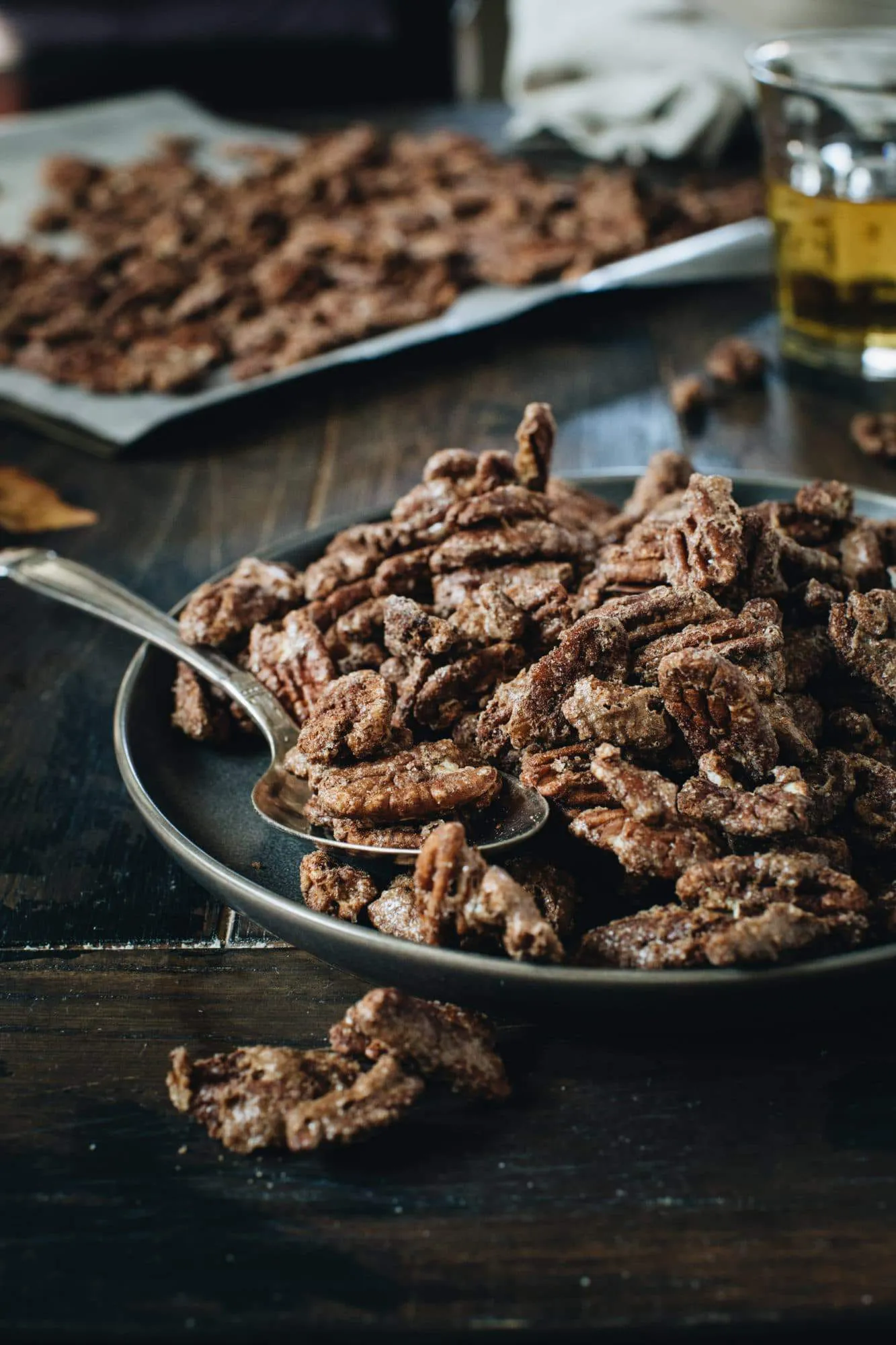 cinnamon roasted pecans on a black plate