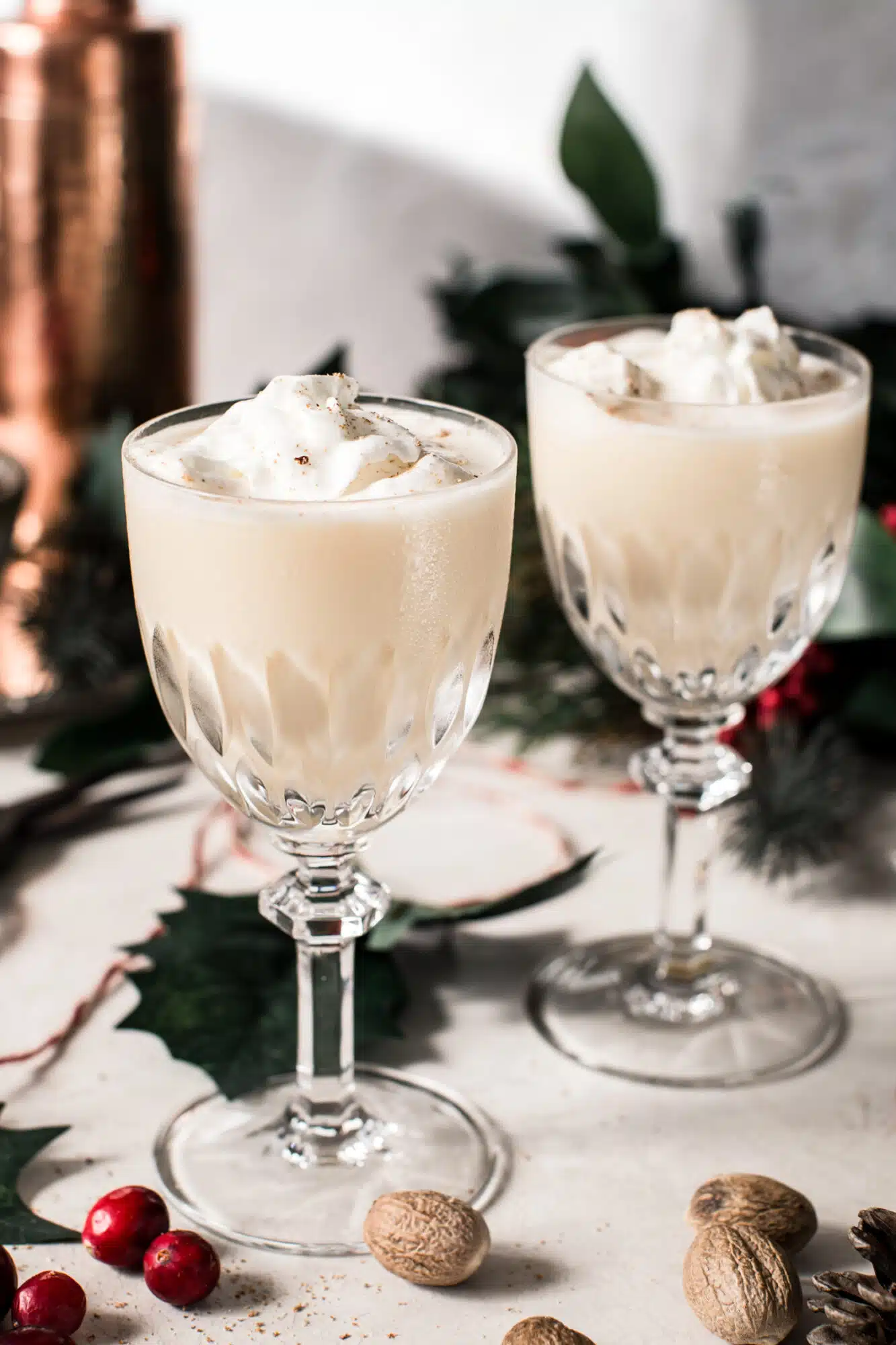 eggnog martini in crystal glasses with whipped cream