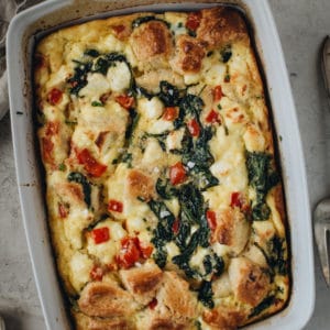 Egg bake in a white casserole dish.