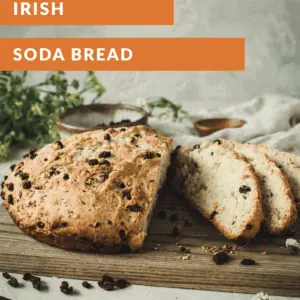 Irish soda bread sliced on a cutting board.