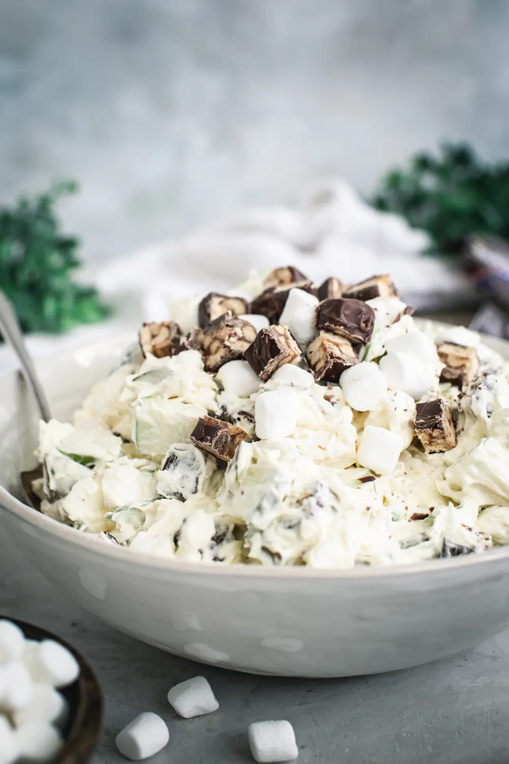 Snickers salad in a white bowl.