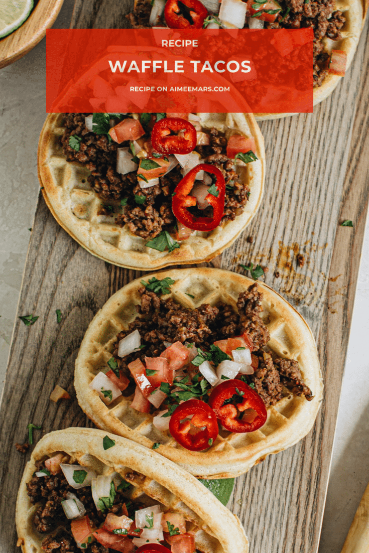 Waffle tacos on wooden cutting board with pico de gallo.