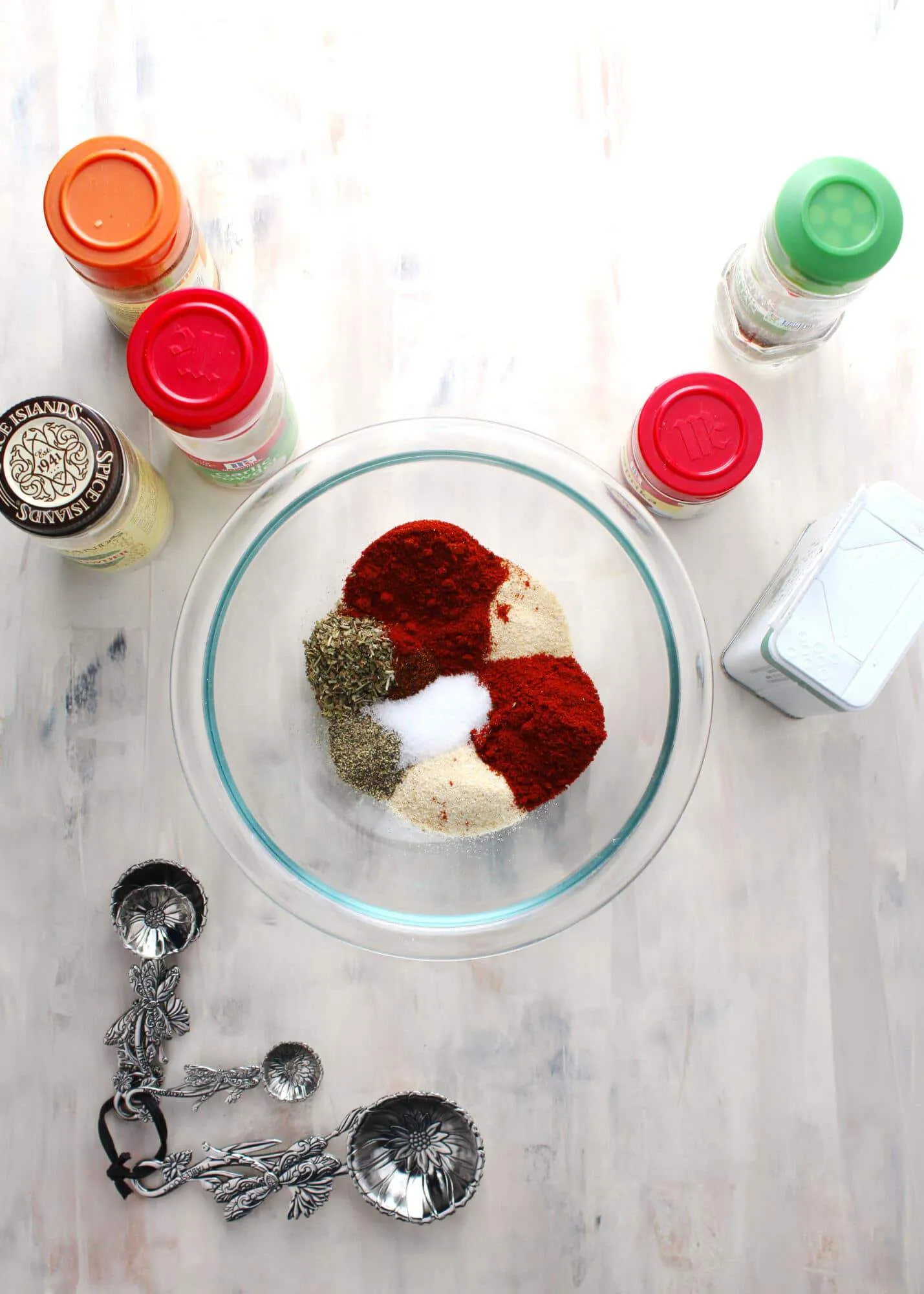 spice ingredients for blackened seasoning in glass bowl