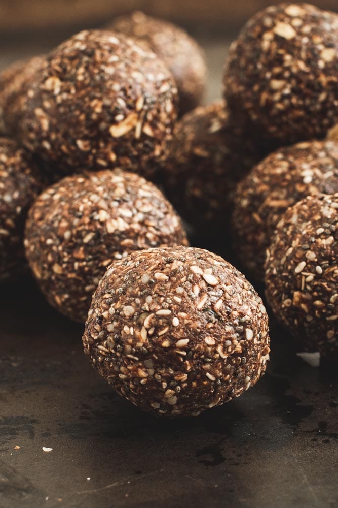 Coconut energy balls coated in cocoa powder and shredded coconut.
