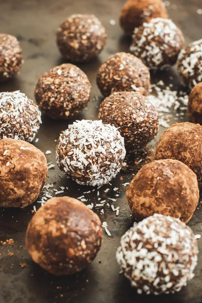 coconut energy balls covered in cocoa and coconut flakes