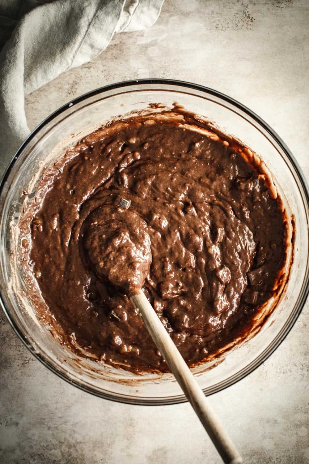 Chocolate banana bread batter in a mixing bowl.
