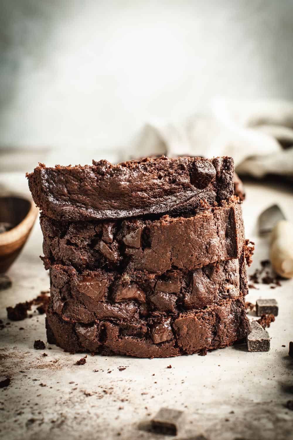 Double chocolate banana bread slices stacked on top of each other.