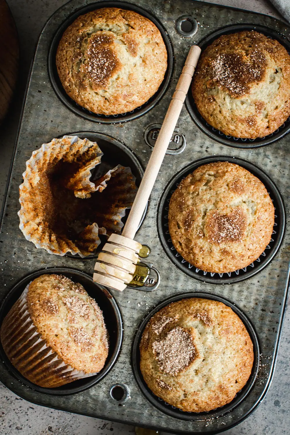Cinnamon sugar banana muffins in a muffin tin.