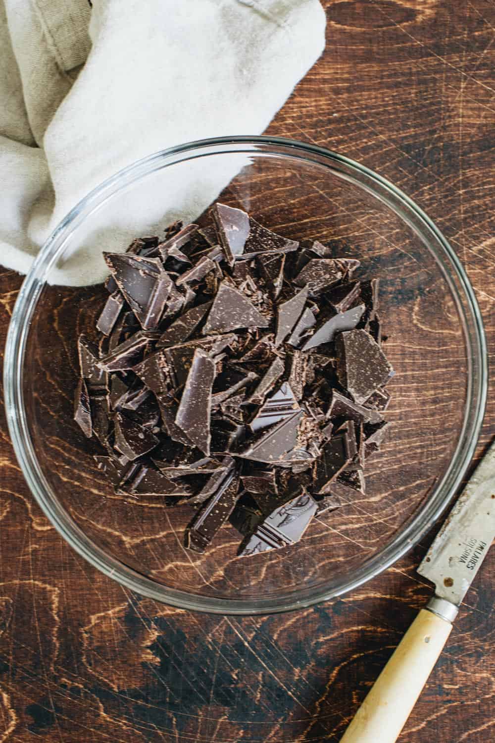 Chopped pieces of chocolate in a mixing bowl.