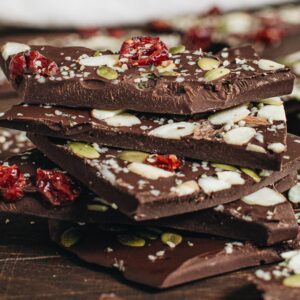 Stacked chocolate bark on wooden table.