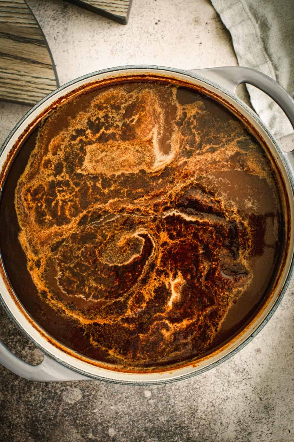Barbecue sauce cooking in a large Dutch oven.