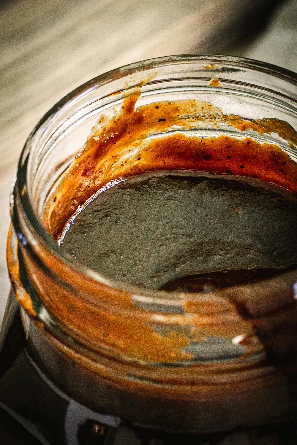 close up of bbq sauce in glass jar