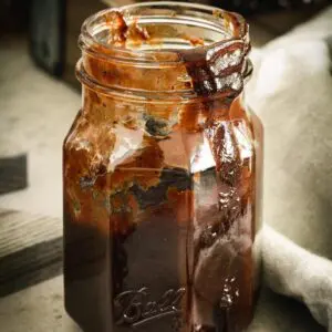Bbq sauce in ball jar dripping down the side.