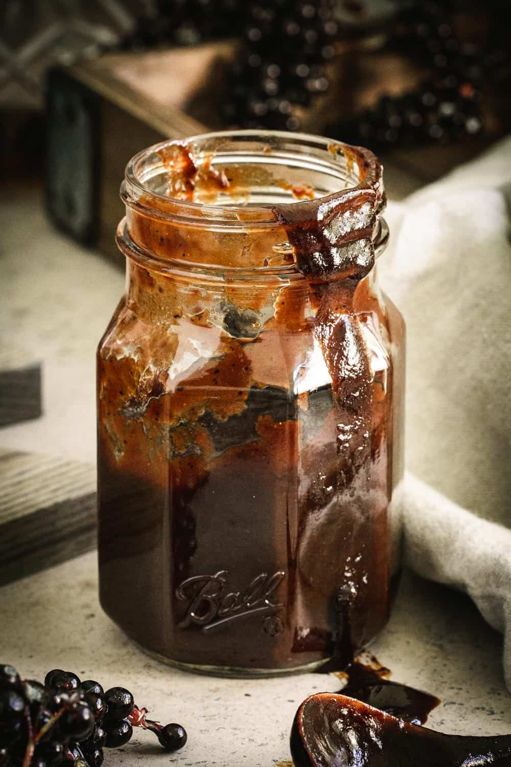 Bbq sauce in ball jar dripping down the side.