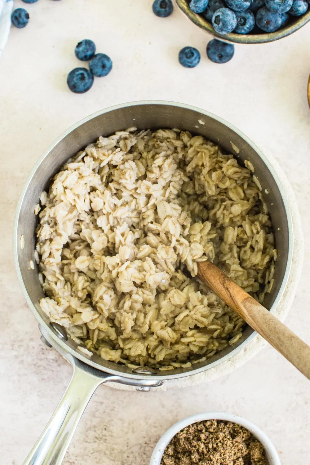 Cooked stovetop oatmeal in pot.