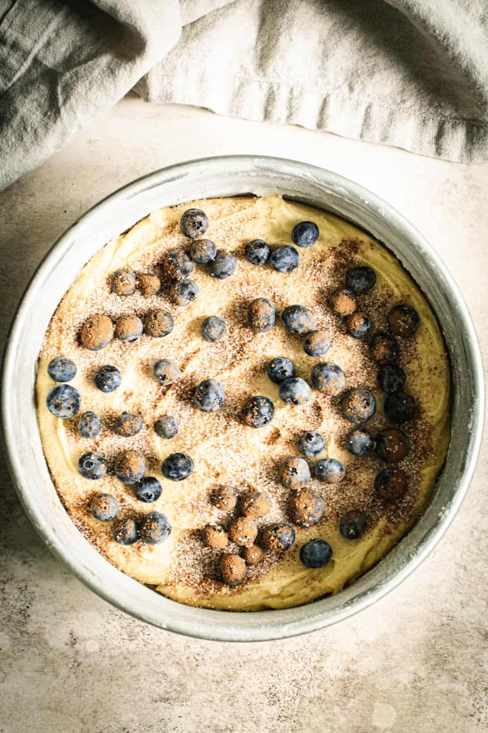 Blueberry torte batter in cake pan.