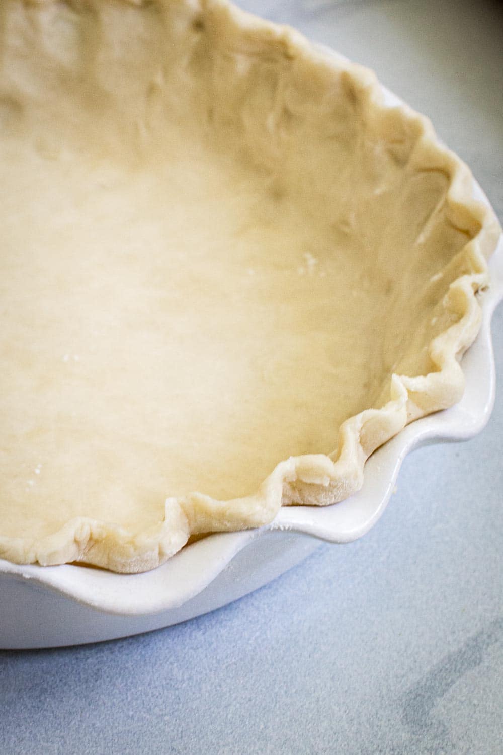 Close up of crinkled edge pie crust.