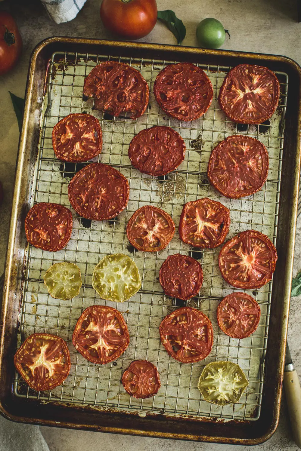 roasted tomatoes on a wire rack in a rimmed baking sheet