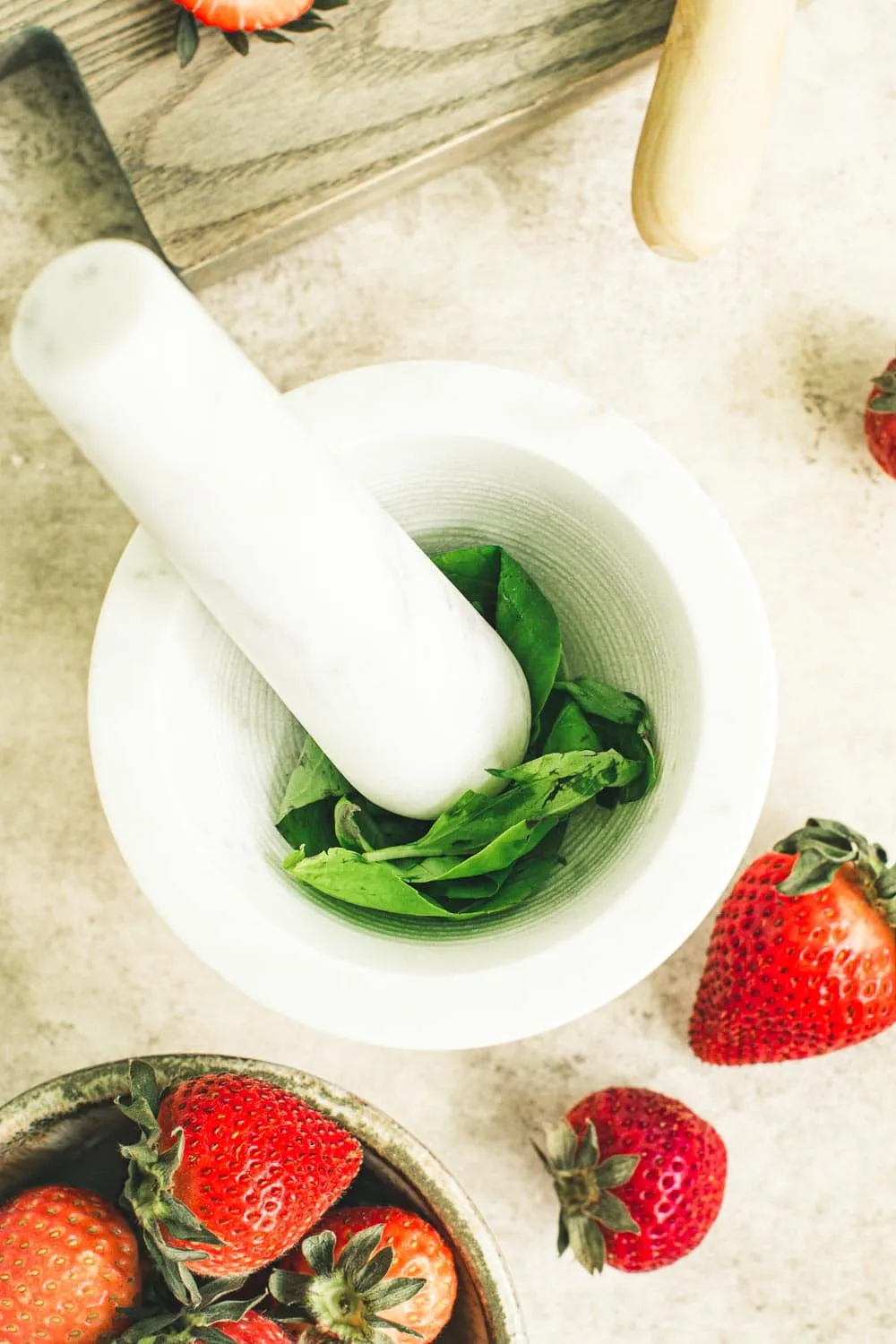 Fresh basil in mortar and pestle.