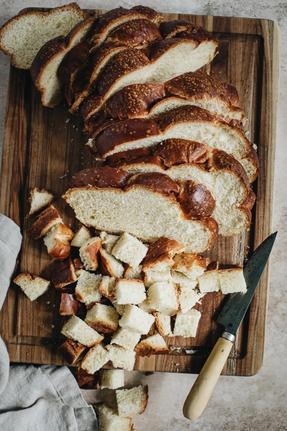 Sliced and cubed challah bread.