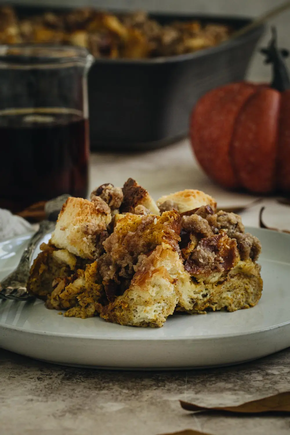 Plain slice of pumpkin French toast casserole on a plate.