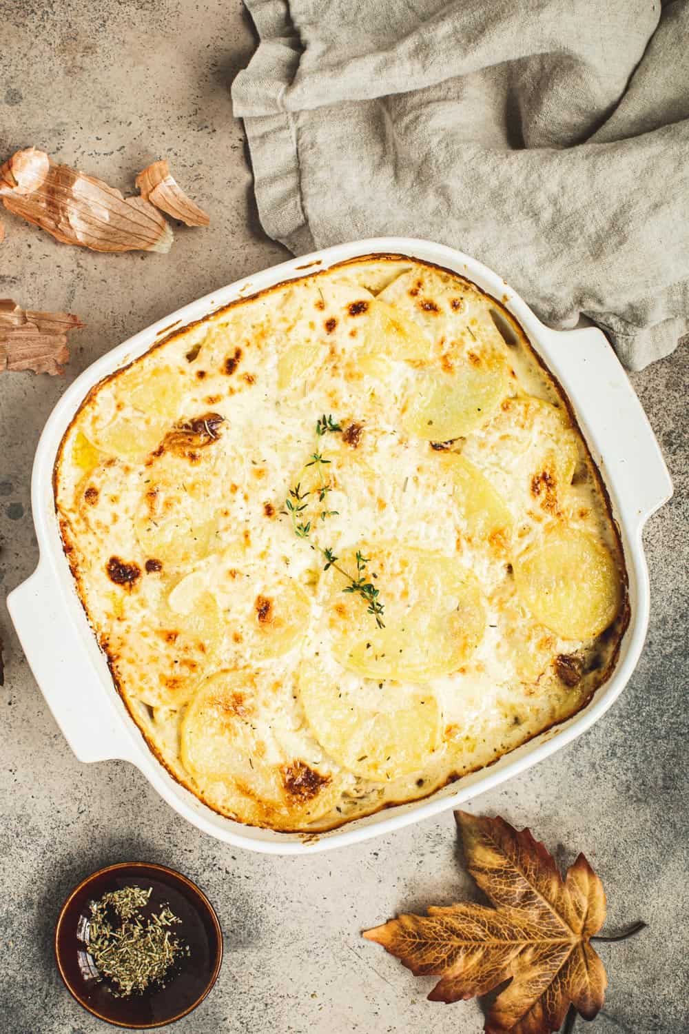 Scalloped Potatoes in a square baking dish.