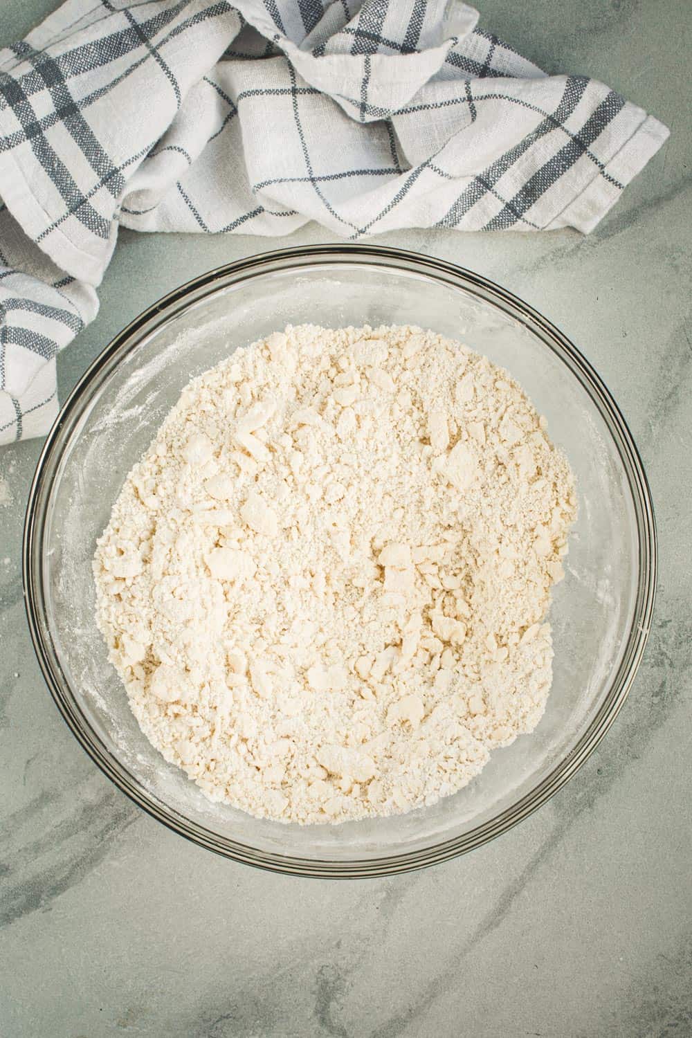 Flaky pie crust ingredients in a mixing bowl.