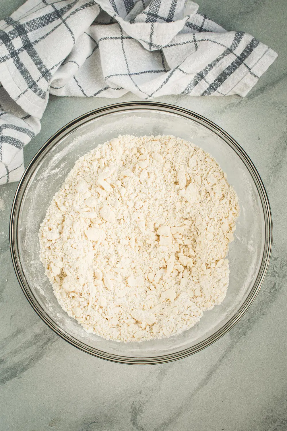 Flaky pie crust ingredients in a mixing bowl.
