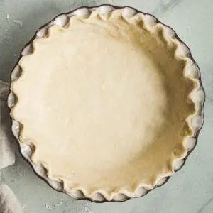 Unbaked pie shell in a pie dish.