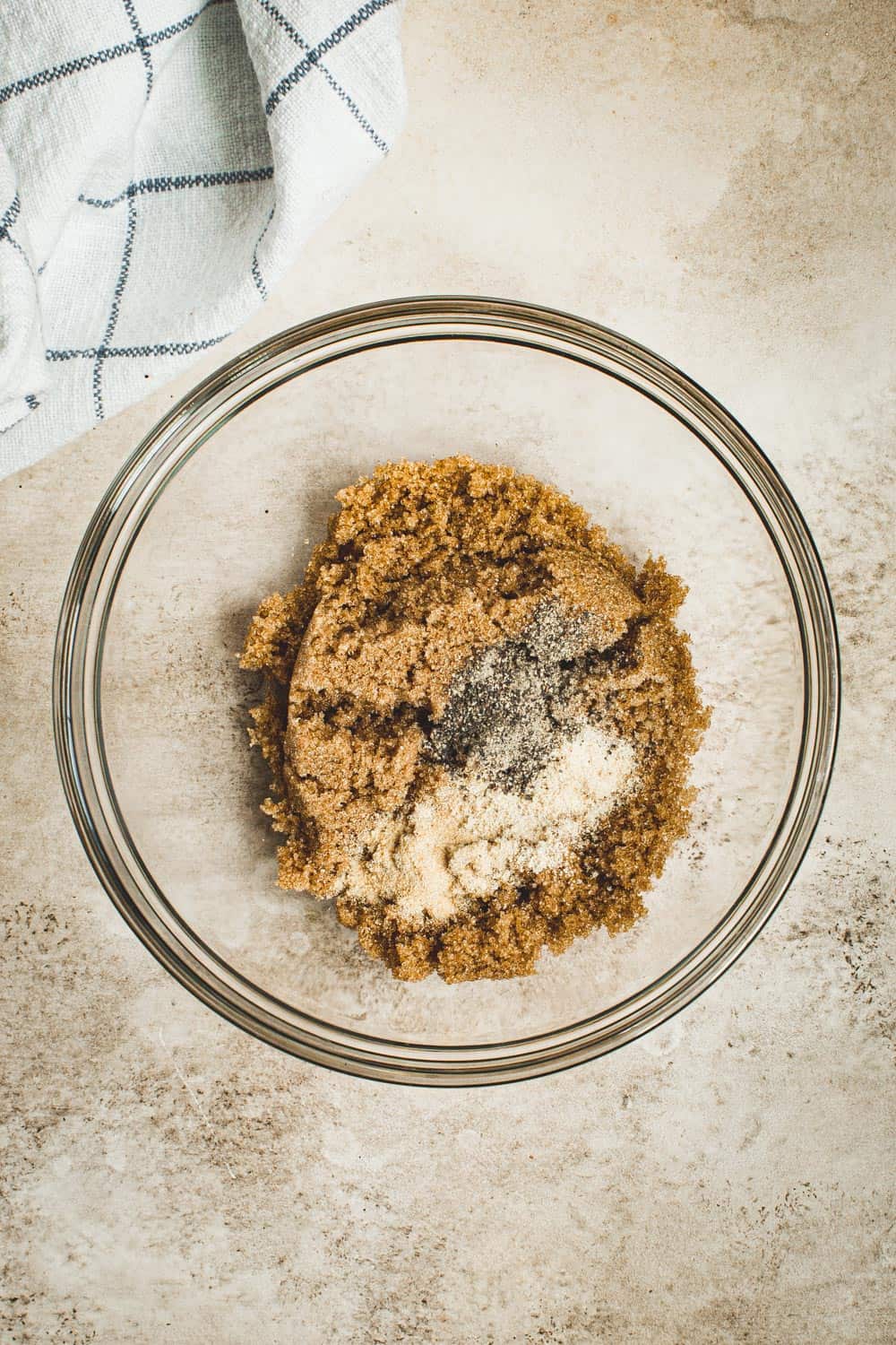 Brown sugar mixture for bacon-wrapped little smokies in glass bowl.