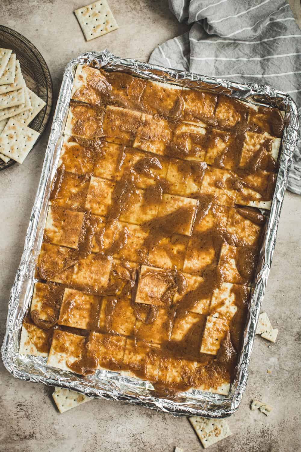 Saltines coated in caramel mixture.
